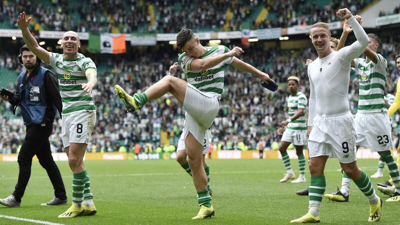 Celtic captain Scott Brown (8) leads the post match celebrations with Celtic's Kieran Tierney (63) and Leigh Griffiths (9) after a 1-0 victory in the Ladbrokes Scottish Premiership match against Rangers at Celtic Park, Glasgow. &nbsp;