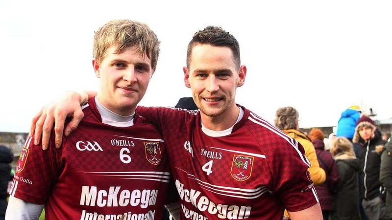 Eoghan Campbell (left) enjoys a moment with team captain Arron Graffin after Cushendall beat Sarsfield's in Navan last month