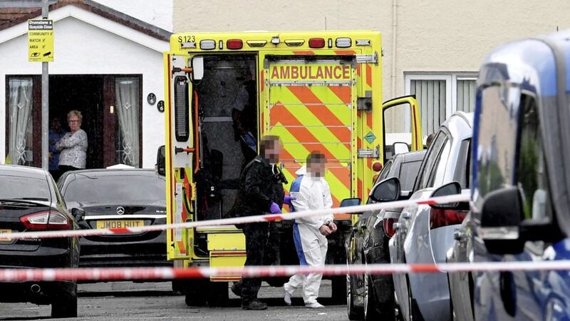 Police arrest a man at the scene in Newry 