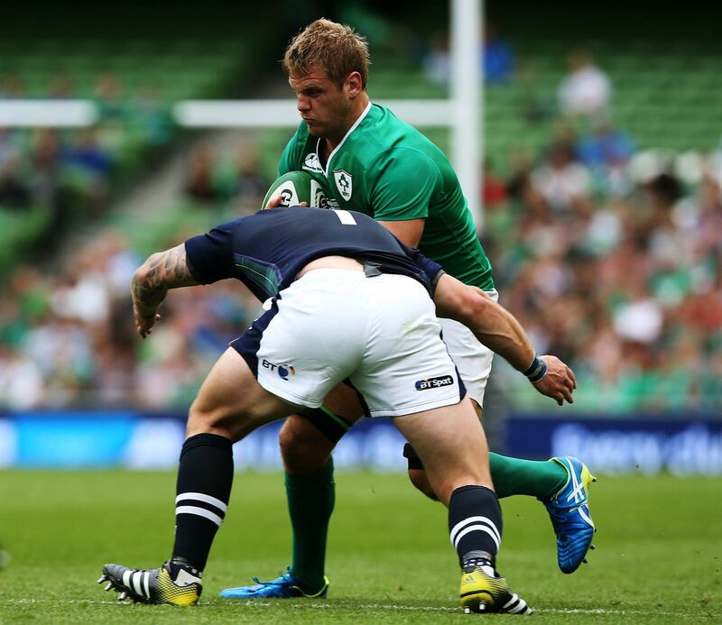 Ireland back row Chris Henry (behind) returned to rugby after a mini-stroke