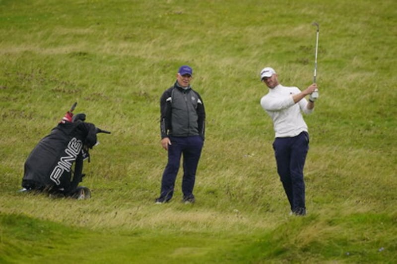 Peter O'Keeffe and his caddie, Karl Bornemann, in action during the final at Lahinch                         Picture: Thos Caffrey/Golffile