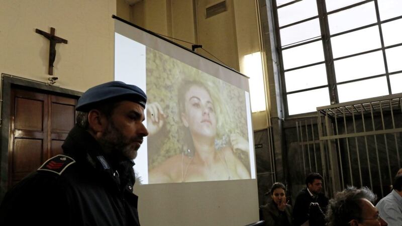 Video evidence is played in a Milan courtroom during a trial on the alleged kidnapping of a British model PICTURE: Antonio Calanni 