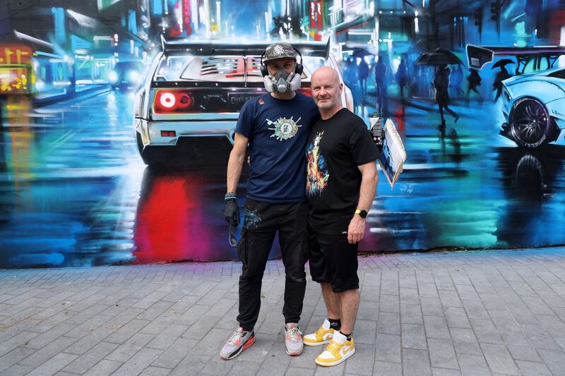 Dan Kitchener with Mitch from the Crown Jesus Ministries who commissioned the mural in Bank Square Belfast. PICTURE: MAL MCCANN