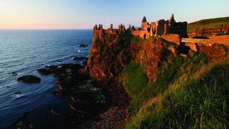 Dunluce Castle which sits close to edge of a headland, along the North Antrim coast 
