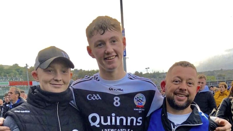 A family affair. Caelan (left) with brother Ryan and their dad Richard McAvoy 