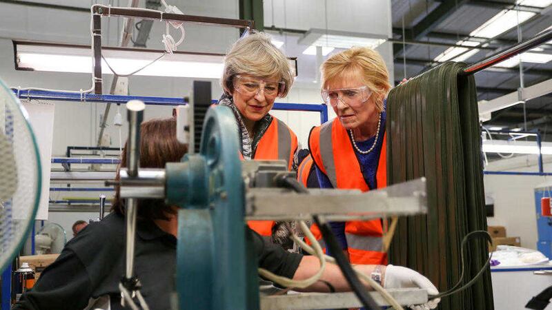 British Home Secretary Theresa May with North Down MP Lady Sylvia Hermon during a visit to Bangor's Denroy Plastics. Picture by Philip Magowan, PressEye