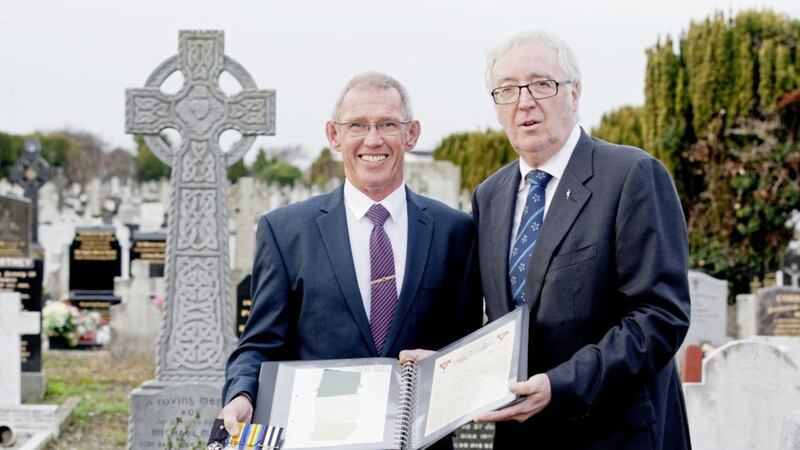David Blake, the great-grandson of John Le Provost, and John Green, chairman of Glasnevin Trust, hold a remnant of the tricolour that flew over Jacob's Biscuit Factory during the 1916 Rising. Picture by Iain White, Fennell Photography/Press Association
