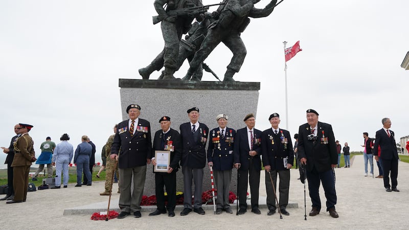 D-Day veterans pose for pictures at the British Normandy memorial statue after the Royal British Legion (RBL) Service of Remembrance to commemorate the 79th anniversary of the D-Day landings, at the British Normandy Memorial in Ver-sur-Mer, Normandy, France. The service remembers the 22,442 servicemen and women from 38 different countries who died under British command on D-Day and during the Battle of Normandy in the summer of 1944. Picture date: Tuesday June 6, 2023.