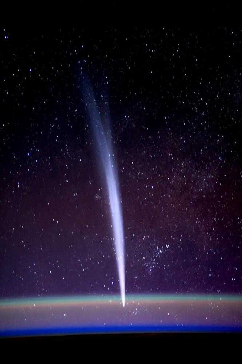 Comet Lovejoy is visible near Earth&#39;s horizon in this photograph taken by Nasa astronaut Dan Burbank from the International Space Station on December 22 2011 