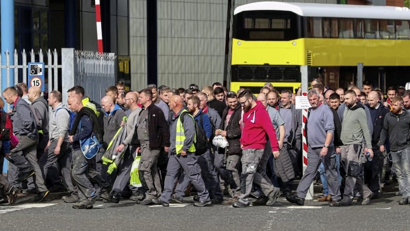 Workers walk through the gates of the Wrightbus plant in Ballymena, Northern Ireland, as the family-owned firm which built London&#39;s distinctive red double decker Routemaster buses is poised to go into administration. Picture by Liam McBurney/PA Wire 