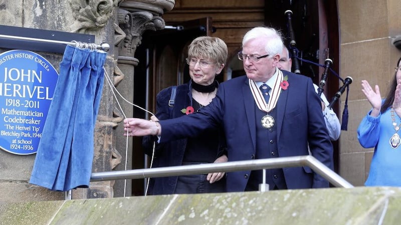 Susan Herivel, daughter of John Herivel, unveils a blue plaque in memory of her father, a mathematician and codebreaker, at Methodist College yesterday. Susan is pictured with Deputy Lord Mayor, Michelle Kelly and Nigel Hamilton, Vice Lord Lieutenant. Picture by Mal McCann 