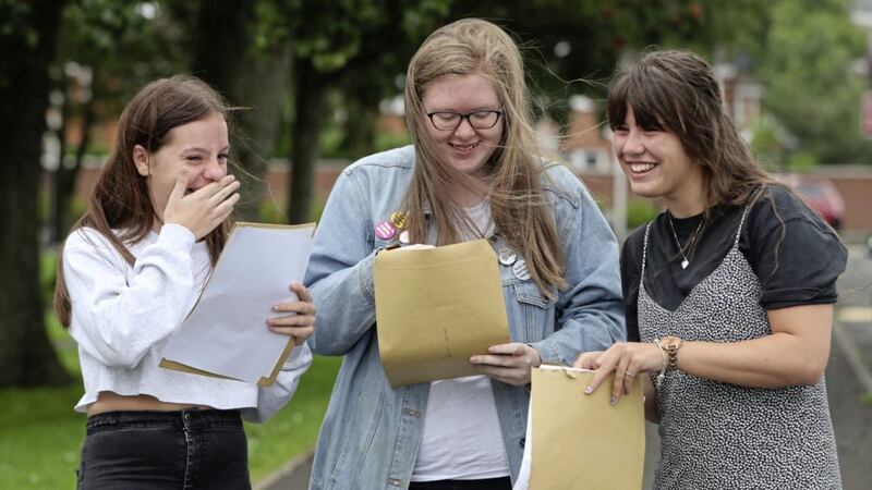 Emma Meek, Lauren Verner and Courtney Campbell of Abbey Community College in Newtownabbey were among the thousands of 18-year-olds who got their A-level results on Thursday. Picture by Niall Carson/PA Wire 