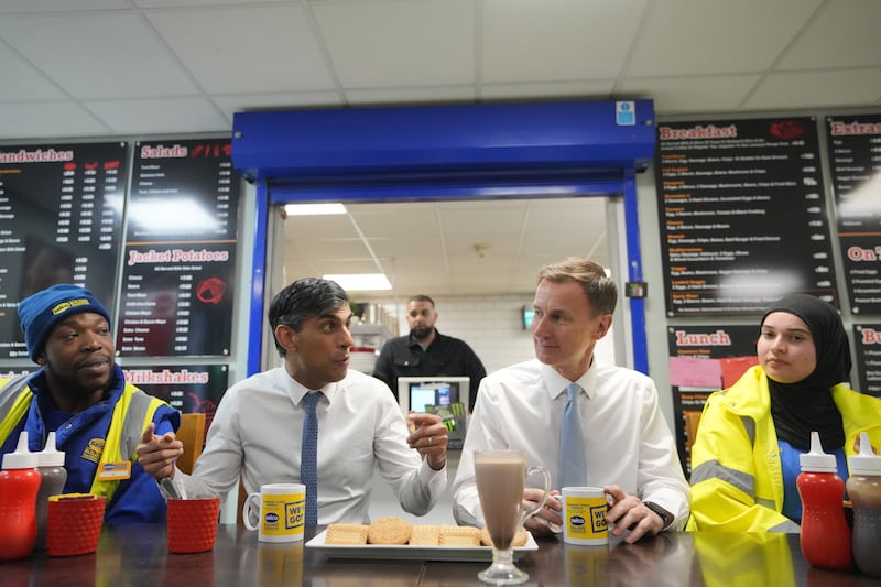 Prime Minister Rishi Sunak and Chancellor of the Exchequer Jeremy Hunt meet staff during a visit to a builders’ merchant in south-east London, after the Chancellor delivered his Budget at the Houses of Parliament