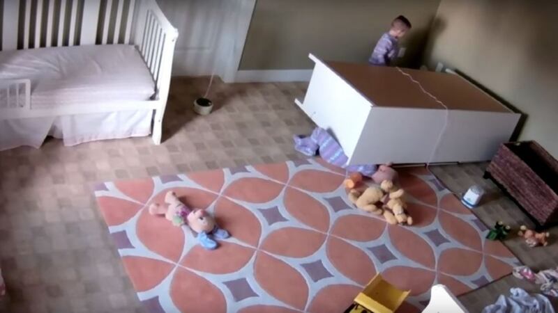 Watch the heart-stopping moment a toddler saves his twin brother after a dresser falls on him