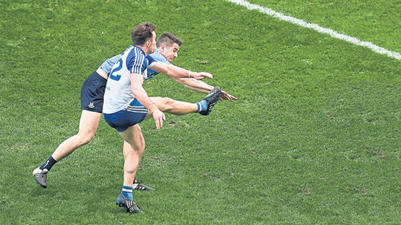 Monaghan&rsquo;s Fintan Kelly fends off the attentions of Dublin&rsquo;s Emmet &Oacute; Conghaile to kick what proved to be the winning point in the 74th minute of yesterday&rsquo;s Allianz Football League Division One encounter at Croke Park&nbsp;