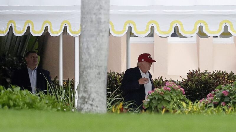 US president-elect Donald Trump walks to his motorcade vehicle at Mar-A Lago in Florida. Picture by Carolyn Kaster, Associated Press