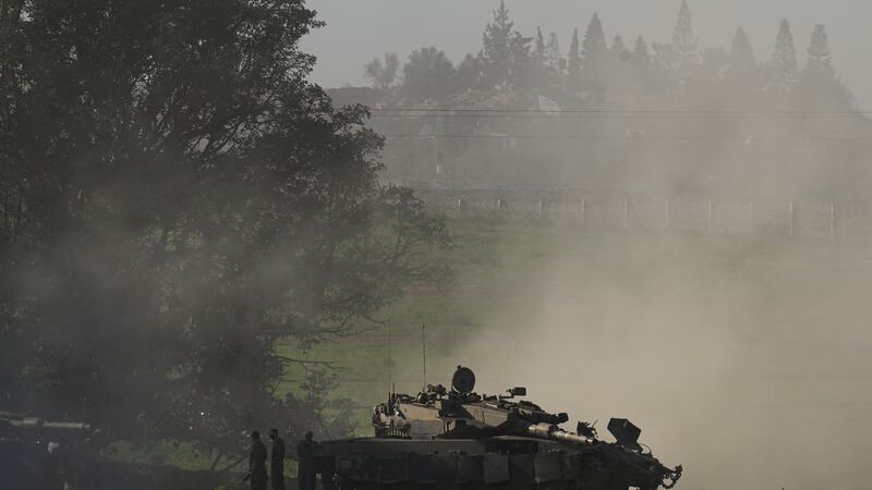 Israeli soldiers are seen near the Gaza Strip border (AP)