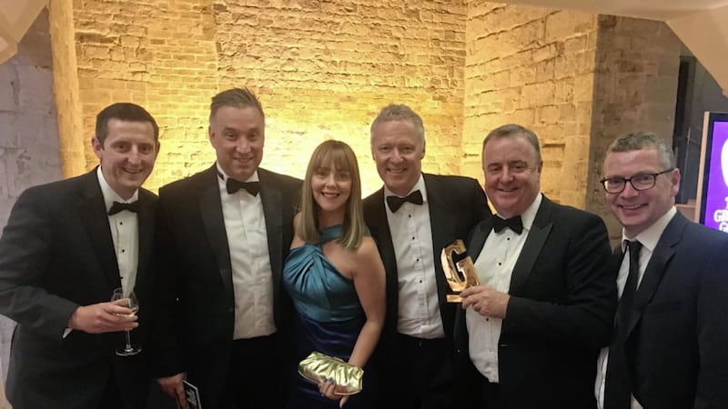 The Henderson Foodservice team celebrate winning the Employer of the Year trophy in the Grocer Gold Awards. Pictured are: Billy Moore, finance director; Mark Stewart-Maunder, business development director; Kiera Campbell, sales director; Rory Bremner; Damien Barrett, managing director and Peter McMeekin, commercial director. 