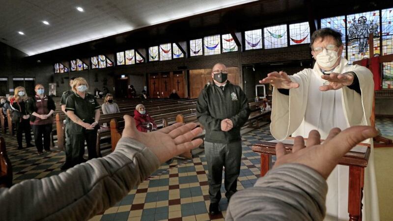 People have their hands blessed in St John&#39;s Church by Fr Martin McMagill as part of Holy Week. Picture by Hugh Russell. 