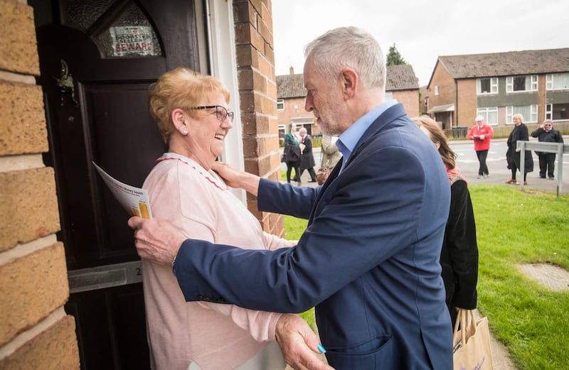 Labour leader Jeremy Corbyn is greeted by Catherine Finney while on the campaign trail in Lancashire