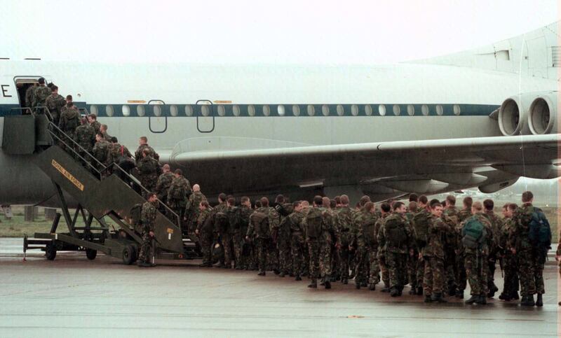 Soldiers from the Parachute Regiment board a plane at RAF Aldergrove in 1997