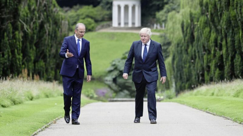 Taoiseach Miche&aacute;l Martin and British Prime Minister Boris Johnson in the gardens of Hillsborough Castle. Picture by Brian Lawless/PA Wire 