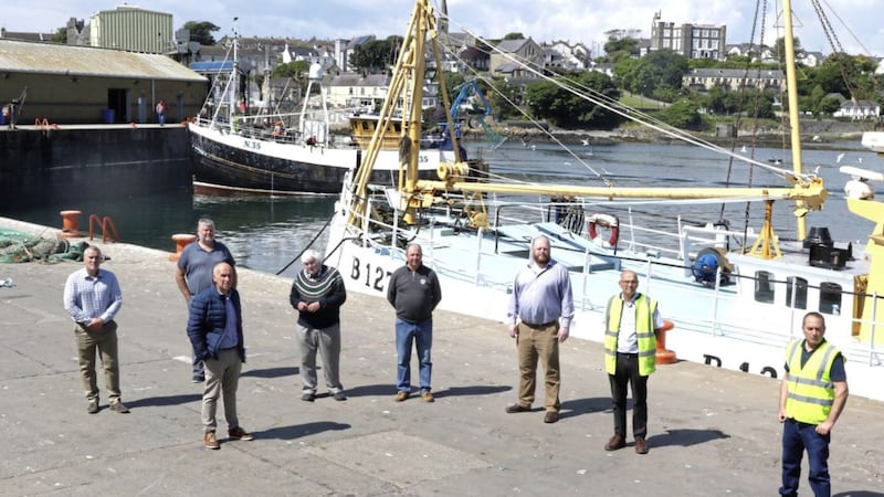 L-R: Owen Lyttle and Stephen Craig (DAERA); Jonathan McGilly (Newry Mourne and Down District Council); Dick James and Basil Wills (AHD); Harry Wick (NIFPO); Kevin Quigley (NIFHA); and Ardglass harbour master James Lenaghan. 