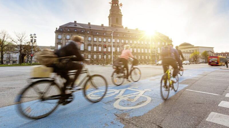 With Christiansborg Palace as the backdrop, many people in Copenhagen prefer biking instead of taking car or bus to move around the city 