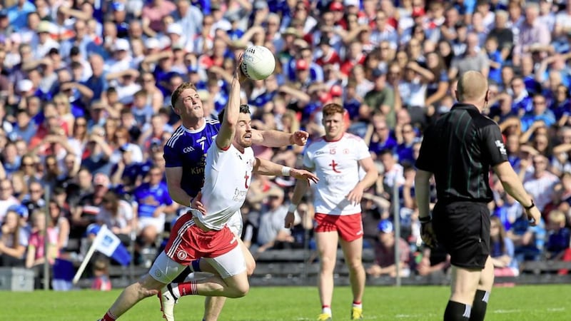 Referee Barry Cassidy watches on as Tyrone&#39;s Matthew Donnelly and Cavan&#39;s Ciaran Brady fight for possession. Cassidy black-carded Peter Harte in the closing stage which dominated the post-match reaction Picture: Philip Walsh. 