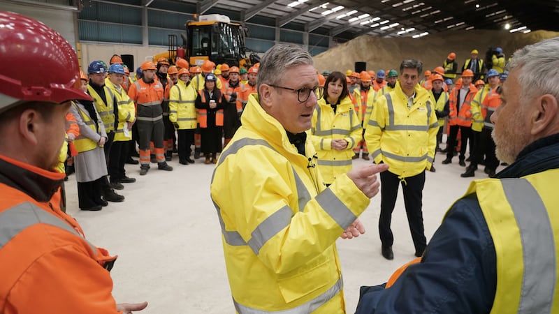 Labour Party leader Sir Keir Starmer talks to union convenor Mark Hannon (right) during a question and answer session with port workers