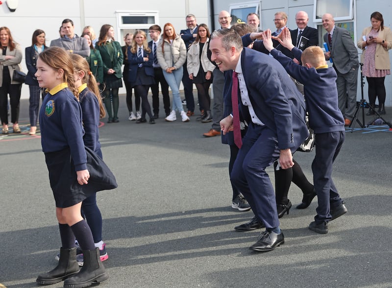 Education Minister Paul Givan takes part in a Ceili, with pupils at Gaelscoil Aodha Rua during his first visit to an Irish language school as Minister.
PICTURE COLM LENAGHAN