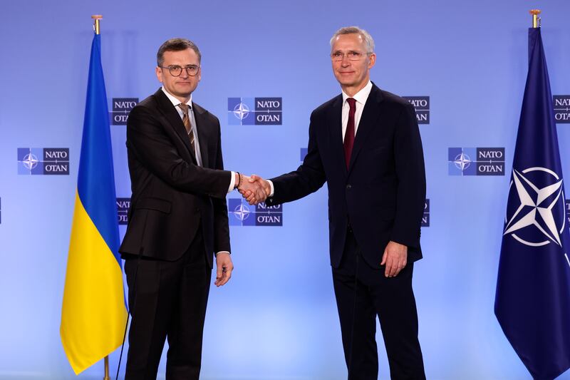 Nato secretary general Jens Stoltenberg, right, shakes hands with Ukraine’s foreign minister Dmytro Kuleba prior to a meeting of the Nato-Ukraine Council at Nato headquarters in Brussels (Geert Vanden Wijngaert/AP)