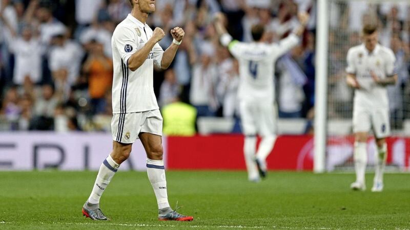 Real Madrid&#39;s Cristiano Ronaldo scored his second successive Champions League hat-trick in the 3-0 win over rivals Atletico 