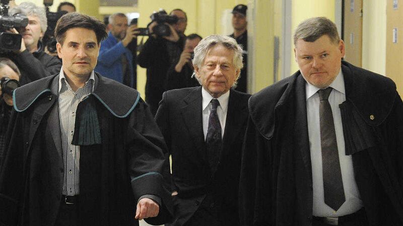 Filmmaker Roman Polanski, centre, with his lawyers, during a court hearing in Poland last year 
