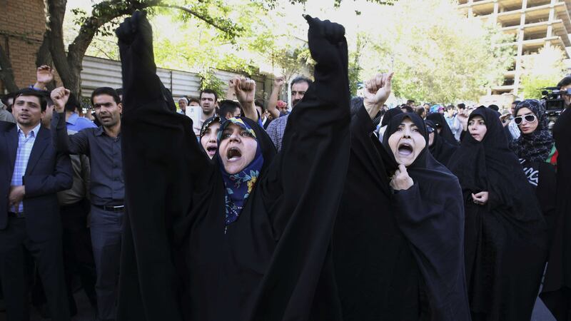 Iranian protesters chant slogans in front of the Saudi Arabian Embassy in Tehran to blame the Arab country for the deadly stampede at the hajj. Picture by Vahid Salemi/AP&nbsp;