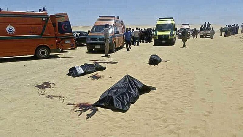 This image released by the Minya governorate media office in Egypt shows bodies of victims killed when gunmen stormed a bus in the area on Friday May 26. Officials said dozens of people were killed and wounded in an attack by masked militants on a bus carrying Coptic Christians, including children, south of Cairo. 