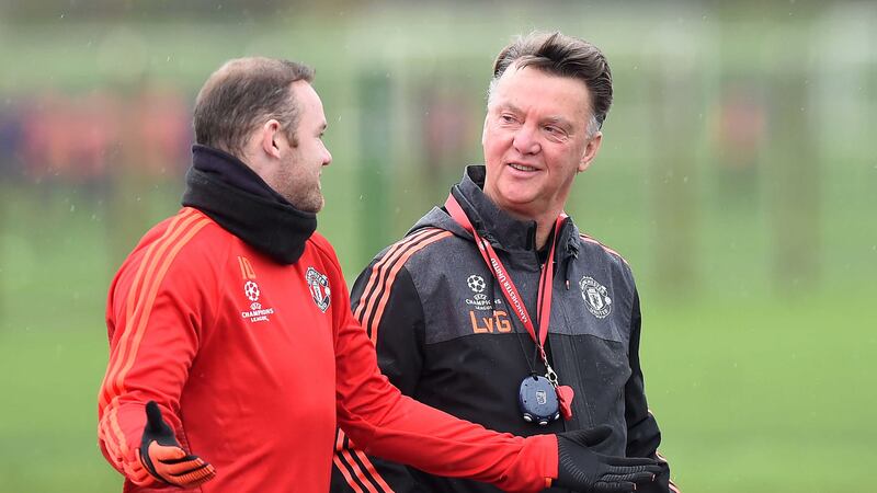 Manchester United manager Louis van Gaal chats with Wayne Rooney during a training session in Carrington on Tuesday<br />Picture by PA