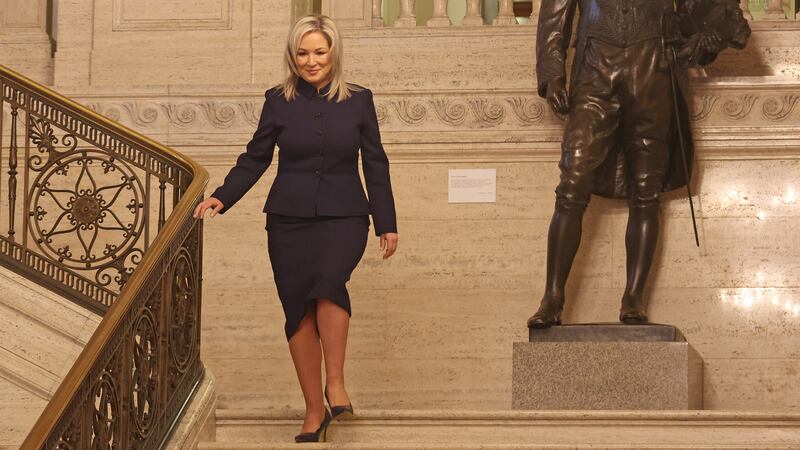 Michelle O’Neill walking down the steps towards the Great Hall in Stormont