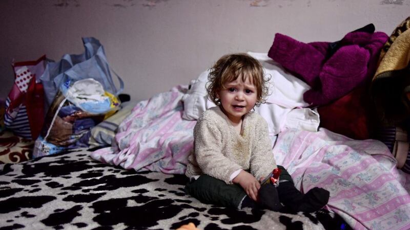 A child sits on a bed in a room hosted by the local Free Christian Church for those fleeing Ukraine, in the village of Uszka, Hungary. More than 1 million people have fled Ukraine following Russia&#39;s invasion in the swiftest refugee exodus in this century, the United Nations has said. Picture by AP Photo/Anna Szilagyi. 