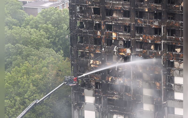 &nbsp;Water is sprayed on Grenfell Tower. Picture by Rick Findler, PA Wire