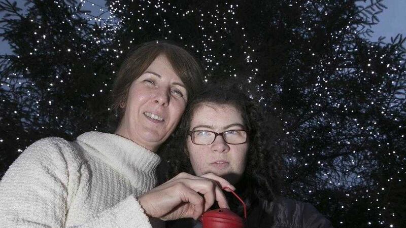 Pauline McGarrity and niece Stacey McLoughlin sponsor a light on the NI Hospice tree in memory of her husband Gerry. Picture by Hugh Russell