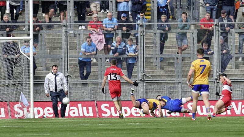 Derry Shane McGuigan (on right) fires a goal past Cian O&#39;Dea and keeper Tristan O&#39;Callaghan of Clare during the All Ireland quarter final match played at Croke Park on Saturday 25th June 2022. Picture Margaret McLaughlin. 