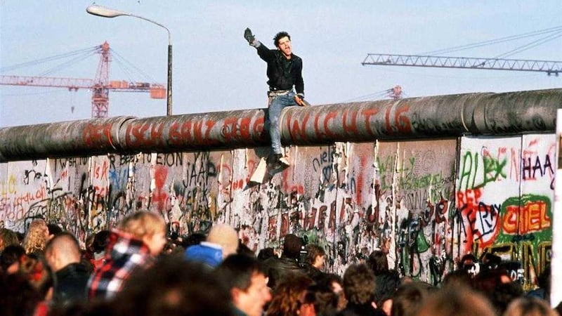 BRINGING DOWN BORDERS: The fall of the Berlin Wall in 1989. But what now for the Ireland border? 