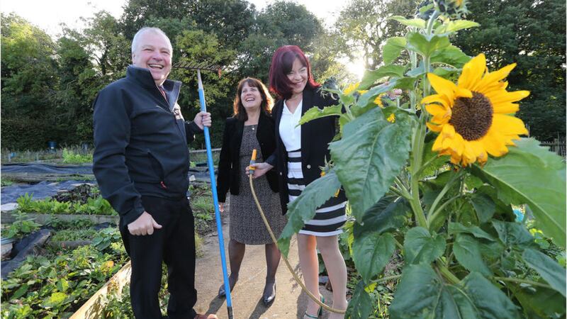 Estate superintendent Tom Wightman with Heidi Seary from Growing Together and Green MLA Clare Bailey at the Stormont allotments Picture: Hugh Russell 