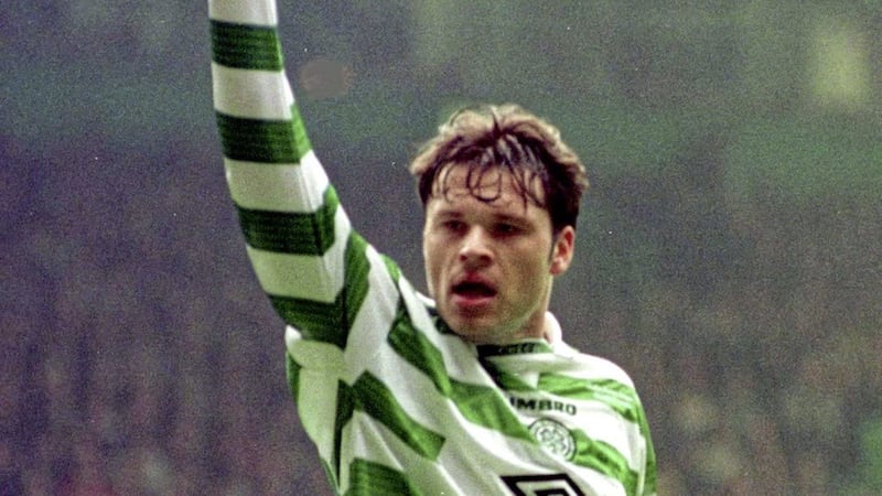 Celtic&#39;s Mark Viduka celebrates after scoring his team&#39;s third goal during their Scottish Premier League match against Dundee at Celtic Park in Glasgow.  