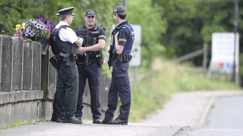 PSNI and Garda officers stand exactly on the border in Belleek ahead of Prime Minster Theresa May&#39;s visit. Picture by Niall Carson/PA Wire 