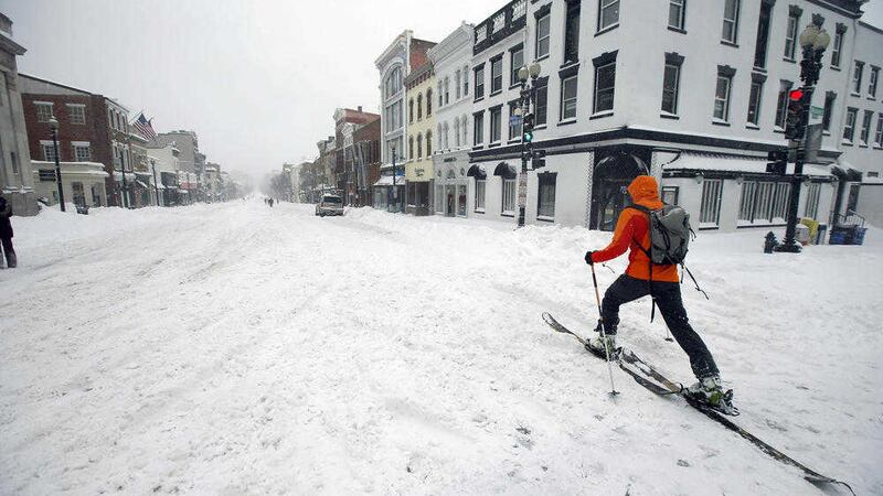 A man uses cross country skies as he goes down M Street NW in the snow in the Georgetown area of Washington&nbsp;