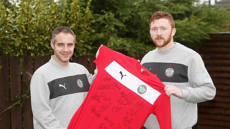 Cliftonville's caretaker coach Gerard Lyttle with Conor Devlin, whom he hails as &quot;the best goalkeeper in the Irish League&quot;