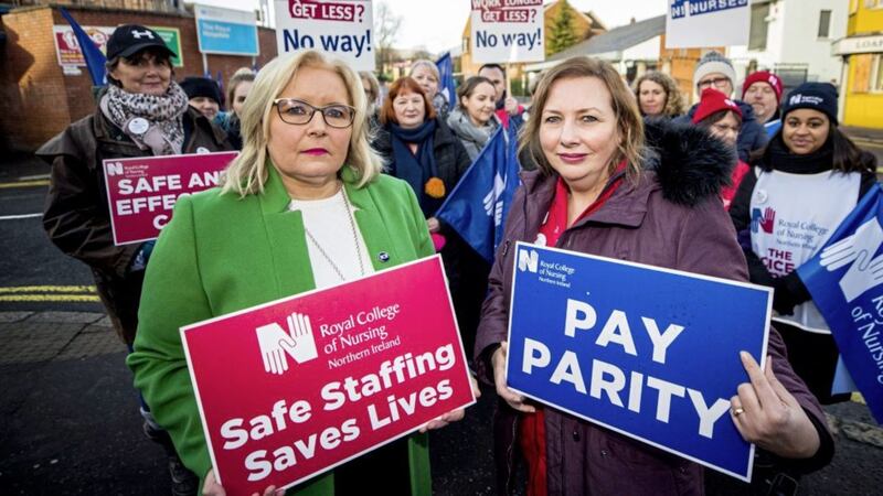 Royal College of Nursing Northern Ireland director Pat Cullen (left) with Royal Belfast Hospital for Sick Children ward sister Ann McDonald on the picket line with nurses and supporters at Belfast's Royal Victoria Hospital last year. The strikes resulted in a deal being struck with government to introduce pay parity and improved staffing numbers