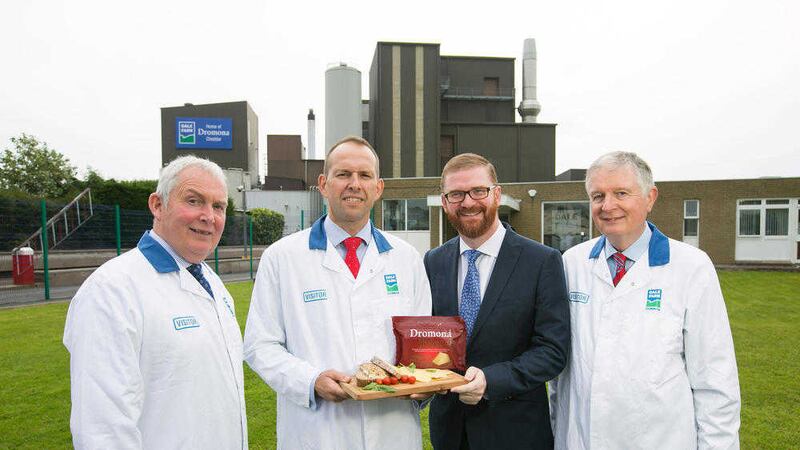 SAY CHEESE: John Dunlop, Chairman of United Dairy Farmers; Nick Whelan, Dale Farm Group Chief Executive; Economy Minister, Simon Hamilton; and David Dobbin, retiring Dale Farm Group Chief Executive, pictured outside the home of Dromona Cheddar, in County Tyrone, Northern Ireland.  